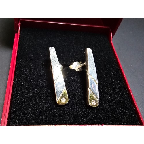 288 - A pair pf pretty 925 silver drop stud earrings with gold layered base to each earring is inset with ... 