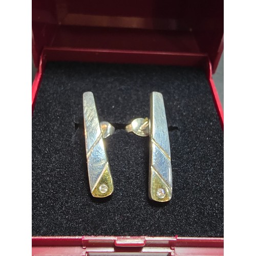 288 - A pair pf pretty 925 silver drop stud earrings with gold layered base to each earring is inset with ... 