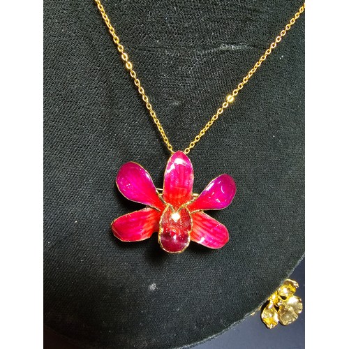 290 - A la belle collection orchid 24K gold plate brooch along with an 18k gold plate enamel pendant neckl... 