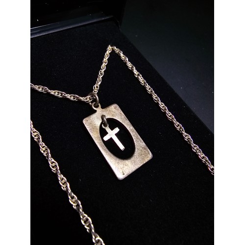 295 - A 925 silver pendant featuring a dangling cross within a silver frame set on a good 16