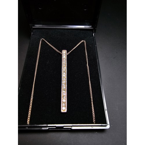 298 - A 925 silver bar pendant channel set with sparkly crystal cz stones on a 16