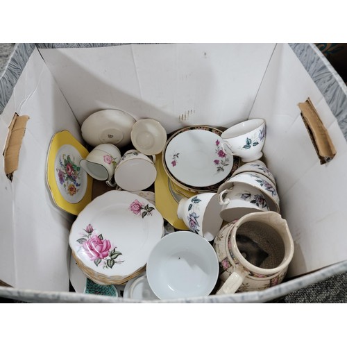 399 - 2 x boxes of ceramic collectables along with a Basket of named glassware in original carriers/boxes