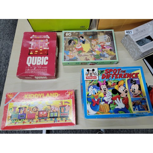 401 - A selection of jigsaw puzzles and games along with a selection of Cd's. To include a Waddingtons spo... 