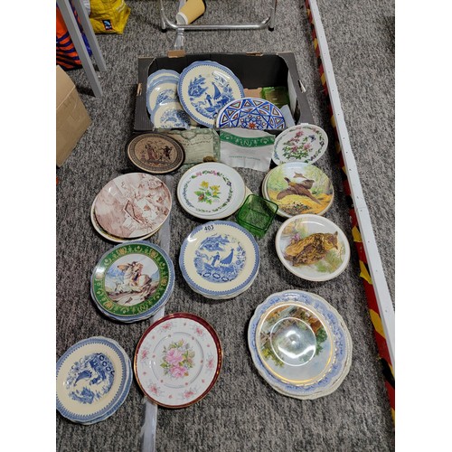 403 - A box full of various ceramic figurines along with some plates etc