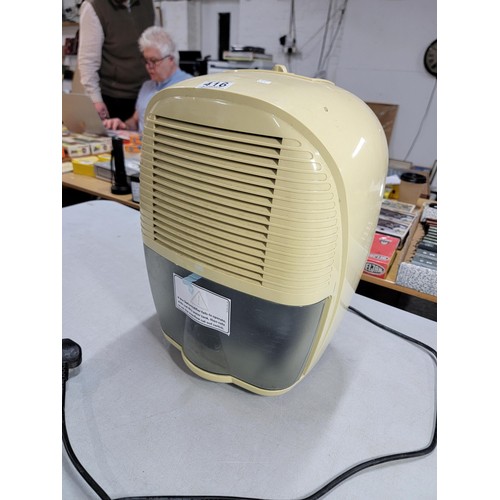 416 - A delongi dehumidifier. in good working order with its detachable water collector