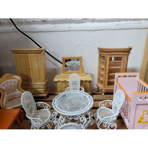 431 - A large comprehensive quantity of dolls house furniture including various room sets which includes p... 