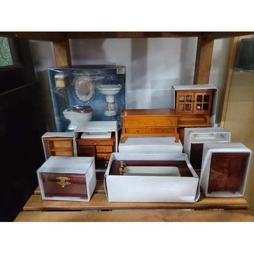 431 - A large comprehensive quantity of dolls house furniture including various room sets which includes p... 