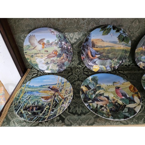 432 - one box and one bag of 12 danbury mint limited edition plates wedgwood plate with COA and a calender... 