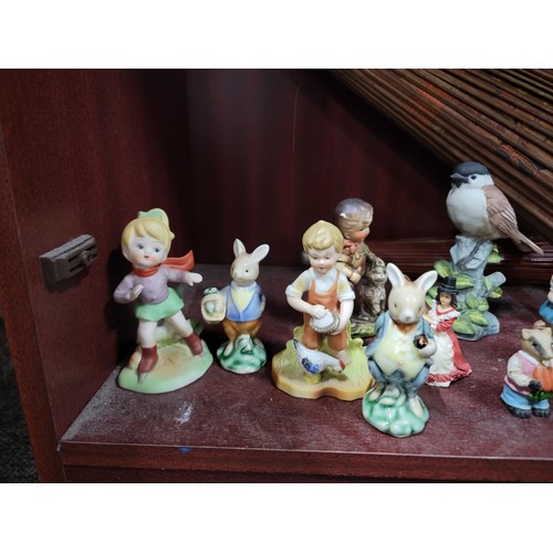 442 - Vast qty ceramic figurines along with two Chinese parasols