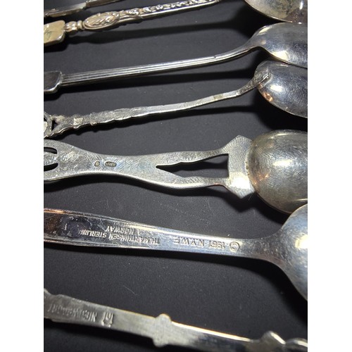 300 - A lot of collectables which includes 9x solid silver tea spoons, a pair of salt and pepper shakers m... 