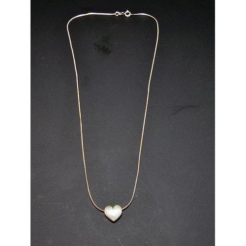 302 - A pretty 925 silver necklace with a heart pendant. Necklace is 16