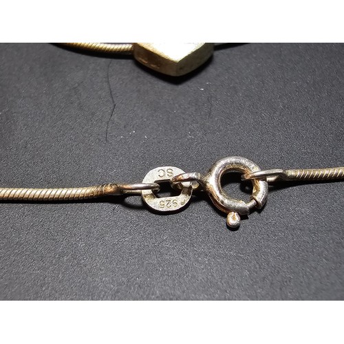 302 - A pretty 925 silver necklace with a heart pendant. Necklace is 16