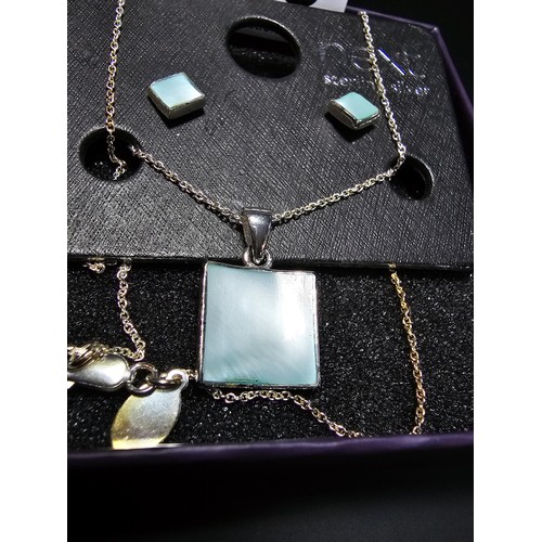 303 - An as new 925 silver matching jewellery set by NEXT which includes a necklace and earrings inset wit... 