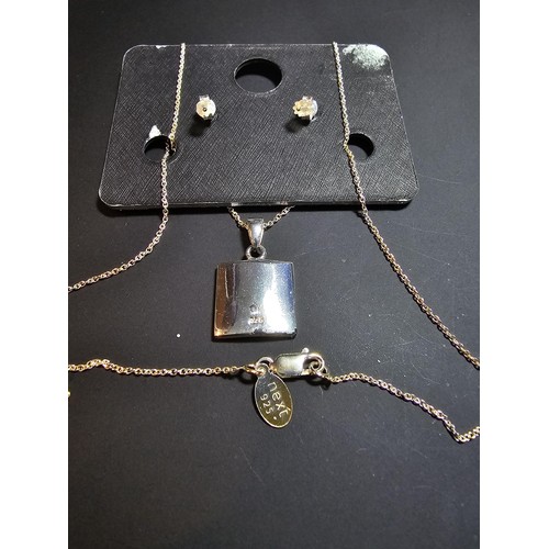 303 - An as new 925 silver matching jewellery set by NEXT which includes a necklace and earrings inset wit... 