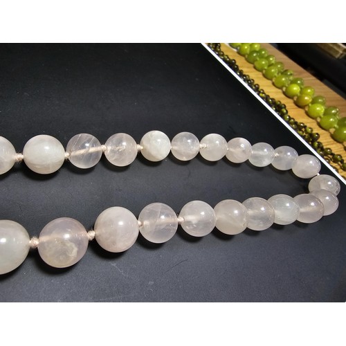 314 - A good quality vintage hand knotted rose quartz beaded necklace with a silver clasp. In excellent cl... 