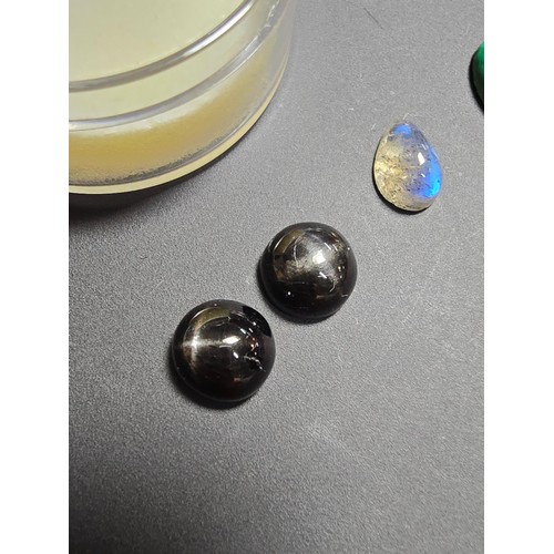 319 - A collection of 6 various polished loose gemstones which includes a good quality tigers eye oval sto... 