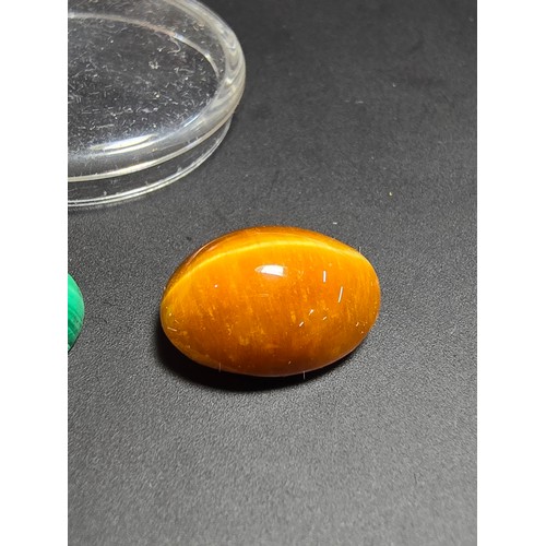 319 - A collection of 6 various polished loose gemstones which includes a good quality tigers eye oval sto... 