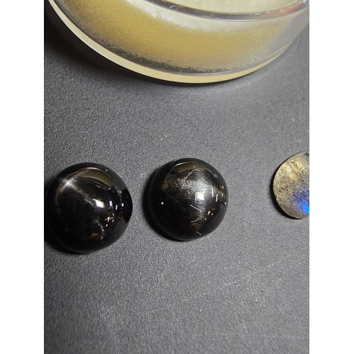 319 - A collection of 6 various polished loose gemstones which includes a good quality tigers eye oval sto... 