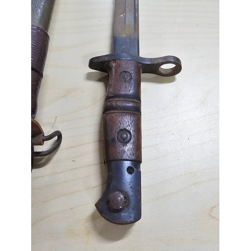 381 - Good WWI US military Remington bayonet and scabbard, the bayonet is marked Remington and dated 1916 ... 