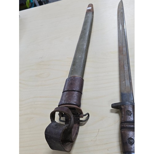 381 - Good WWI US military Remington bayonet and scabbard, the bayonet is marked Remington and dated 1916 ... 