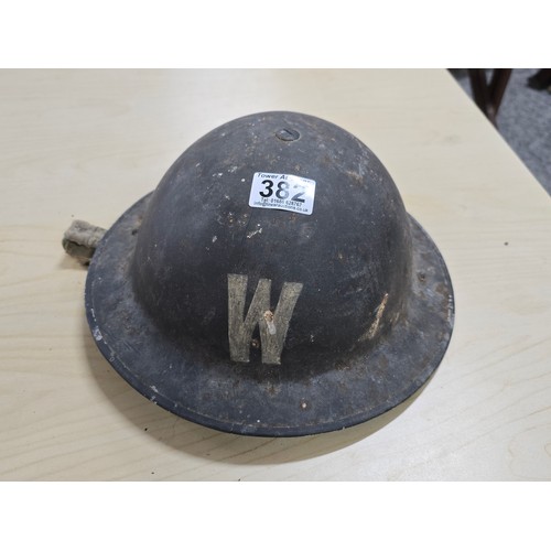 382 - Genuine WWII air raid wardens metal helmet with a W marked to front and rear an interesting piece of... 