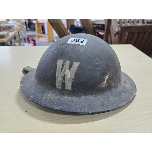 382 - Genuine WWII air raid wardens metal helmet with a W marked to front and rear an interesting piece of... 