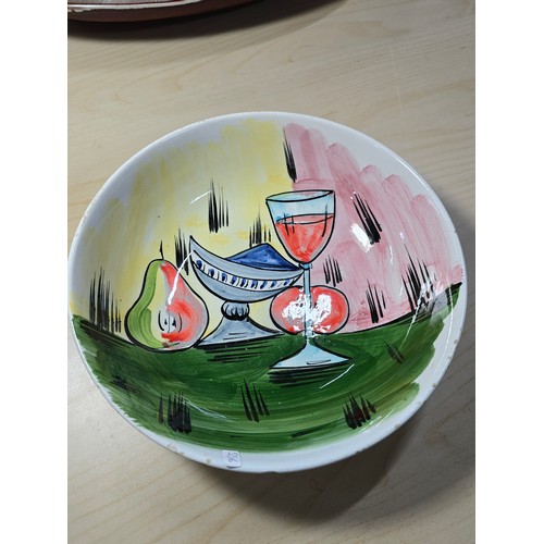 384A - An attractive vintage hand painted bowl with a wine glass and fruit design marked to the base made I... 