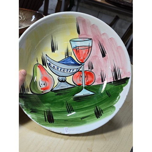 384A - An attractive vintage hand painted bowl with a wine glass and fruit design marked to the base made I... 