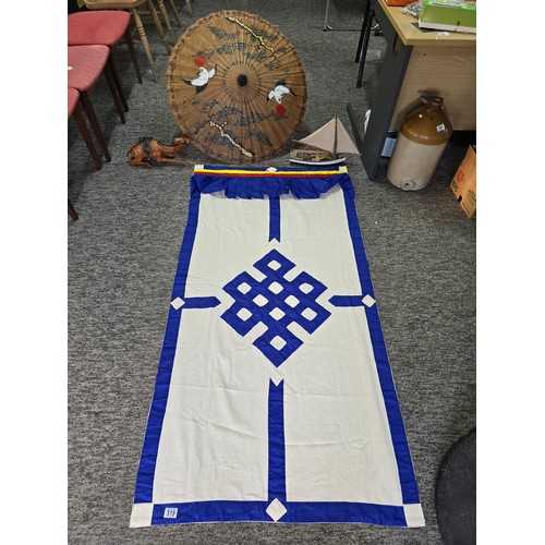 519 - Large Tibetan eternal knot door curtain along with a large leather wrapped figure of a camel a good ... 