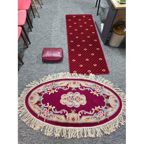 524 - Oriental hand knotted thick pile rug along with a red runner rug and a red leather kneeler, the orie... 