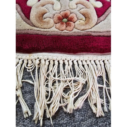 524 - Oriental hand knotted thick pile rug along with a red runner rug and a red leather kneeler, the orie... 