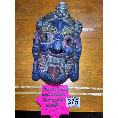 375 - A good vintage Tibetan Mahakala protective spirit mask crowned with 3 citipati heads. In good condit... 