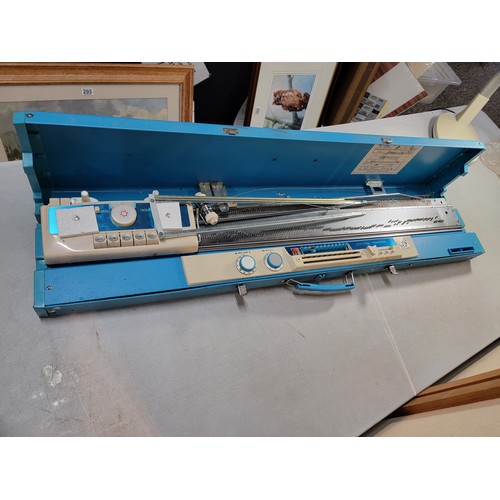 235 - Boxed Toyota Knitting machine, in good overall condition comes with instructions and hard case only ... 