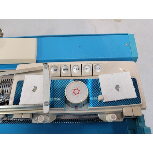 235 - Boxed Toyota Knitting machine, in good overall condition comes with instructions and hard case only ... 