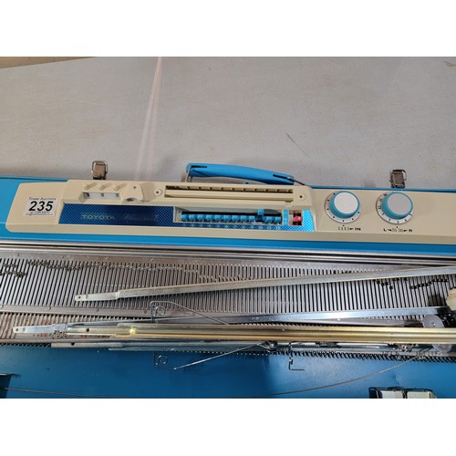 235 - Boxed Toyota Knitting machine, in good overall condition comes with instructions and hard case only ... 