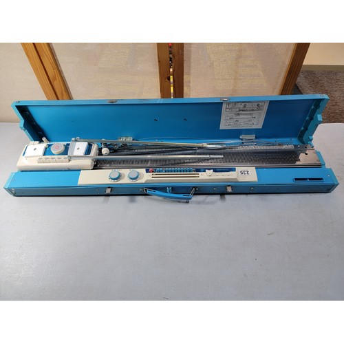 235 - Boxed Toyota Knitting machine, in good overall condition comes with instructions and hard case only ... 