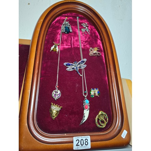 208 - Good quality display board (included) displaying a quantity of costume jewellery inc small bee forme... 