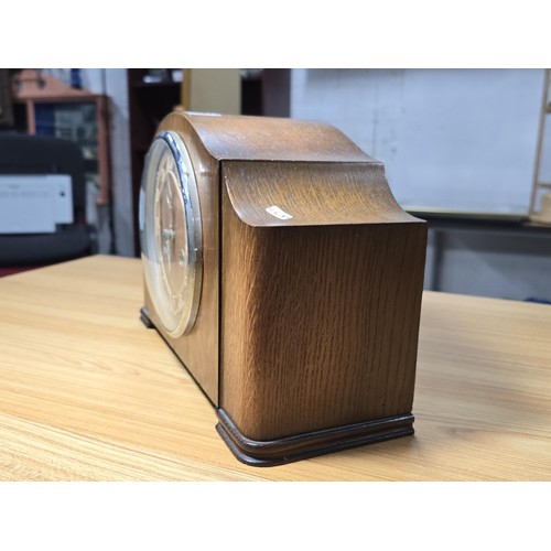 280 - A vintage oak mantel clock with an unusual pierced dial having an Enfield 8 day movement and complet... 