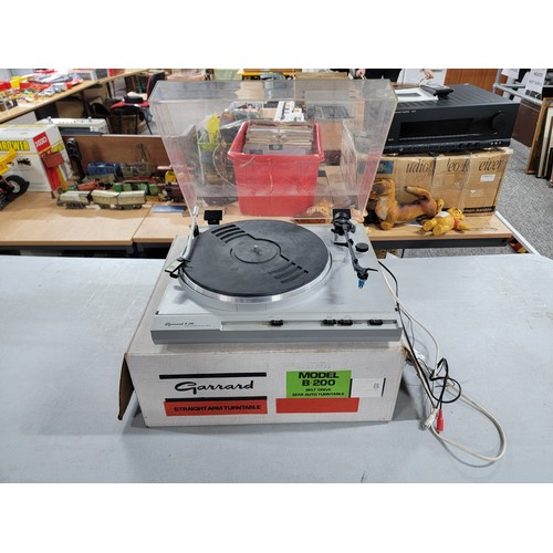 6 - A Garrard B-200 semi-automatic belt driven turn table complete with Metrosound brushing arm and styl... 