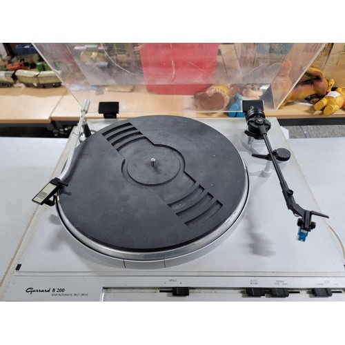 6 - A Garrard B-200 semi-automatic belt driven turn table complete with Metrosound brushing arm and styl... 