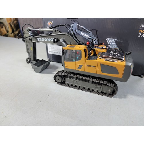 19 - A Boxed New remote control excavator by Yigong in full working order with metal bucket and engine co... 