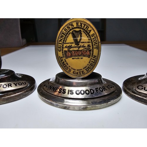 150 - A set of 3 rare 1930's Guinness place holders which are silver plated with tortoise shell bases with... 