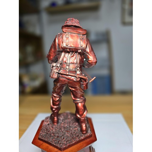 152 - An impressive Danbury mint The Liberator WWII bronzed resin solider figure with a set of 5 British c... 