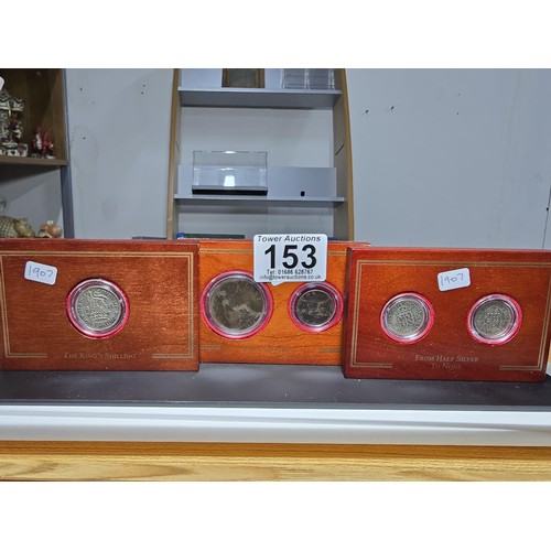 153 - A set of 3x coins sets set in wooden plinths by British coin treasure collection which includes from... 