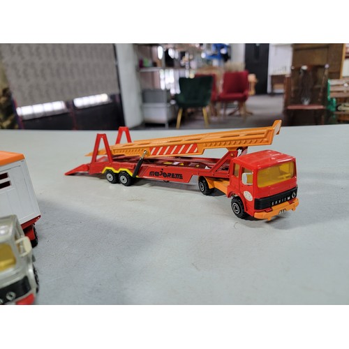 23 - Collection of 7x diecast vehicals inc a majorette car transporter, matchbox petrol tanker, solide ho... 