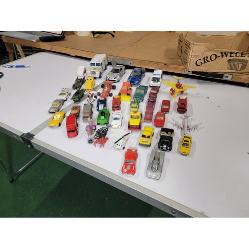 29 - Large quantity of diecast vehicles inc a subaru imprezza, rescue helicopter, fire engine, landrover,... 