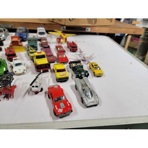 29 - Large quantity of diecast vehicles inc a subaru imprezza, rescue helicopter, fire engine, landrover,... 