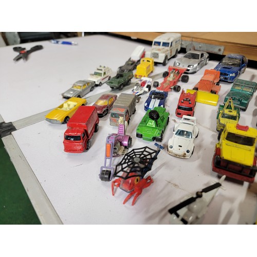 29 - Large quantity of diecast vehicles inc a subaru imprezza, rescue helicopter, fire engine, landrover,... 