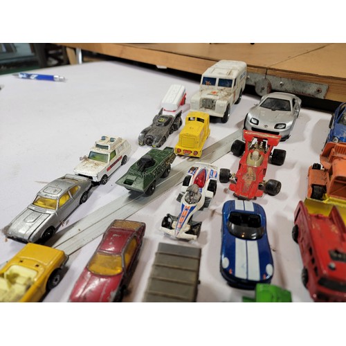 29 - Large quantity of diecast vehicles inc a subaru imprezza, rescue helicopter, fire engine, landrover,... 