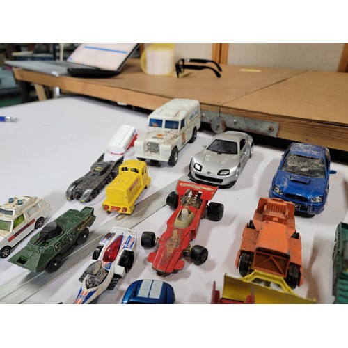 29 - Large quantity of diecast vehicles inc a subaru imprezza, rescue helicopter, fire engine, landrover,... 